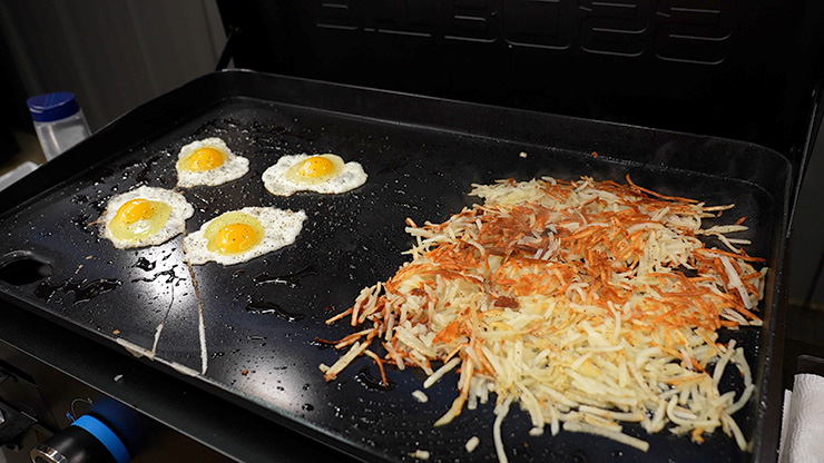 eggs and potatoes cooking on the Pit Boss Ultimate Lift Off Griddle