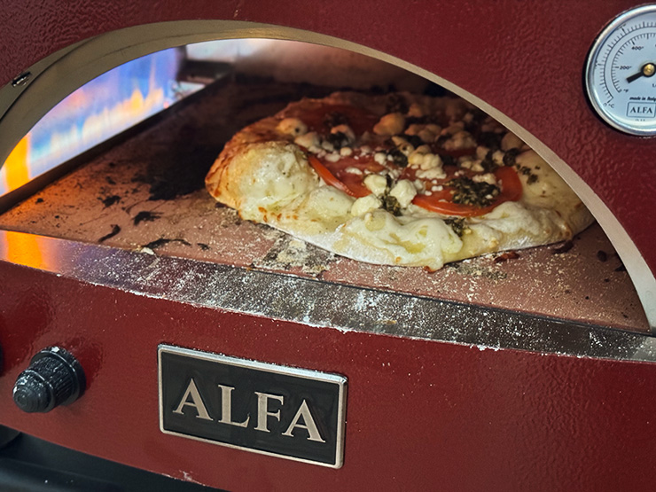 pizza cooking inside the alfa forni moderno pizza oven