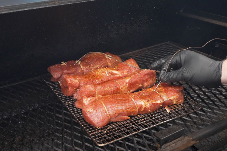 pork tenderloins in the smoker with temperature probes 