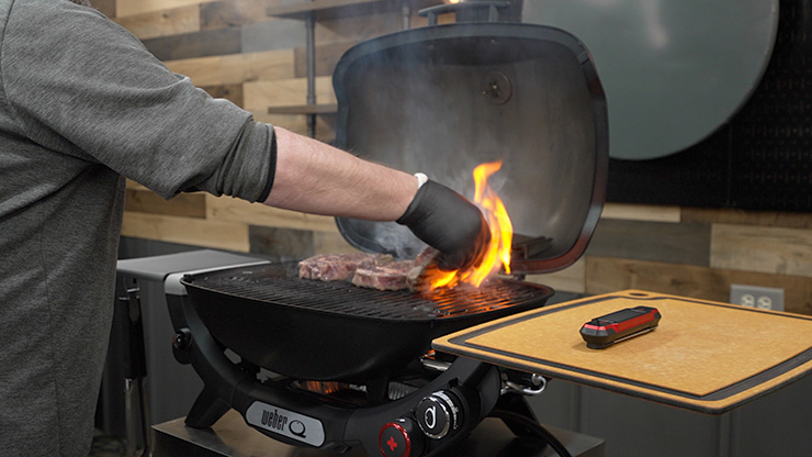 ribeye steak on a Weber portable gas grill