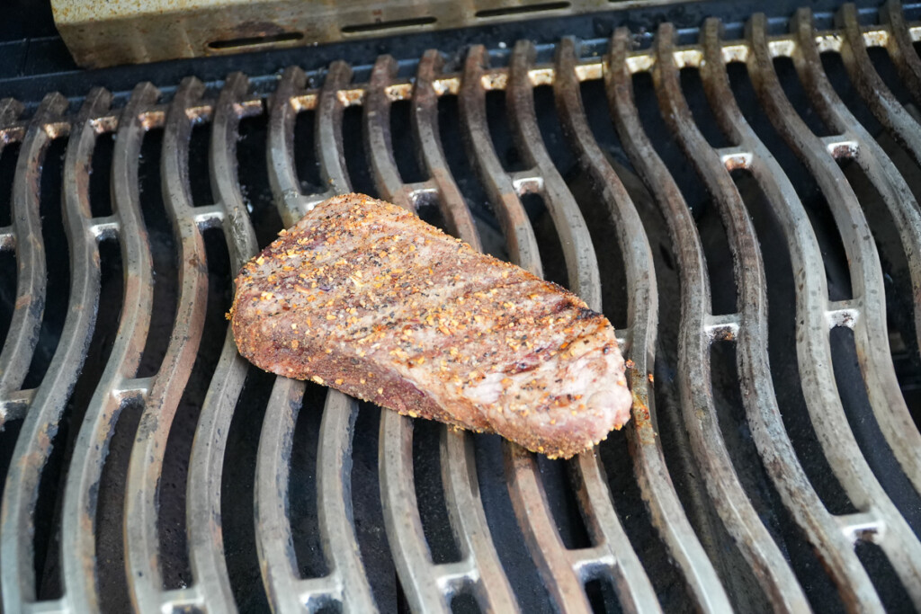 cooked steak on the grill