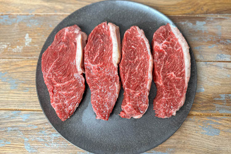 cheap steak cuts on plate