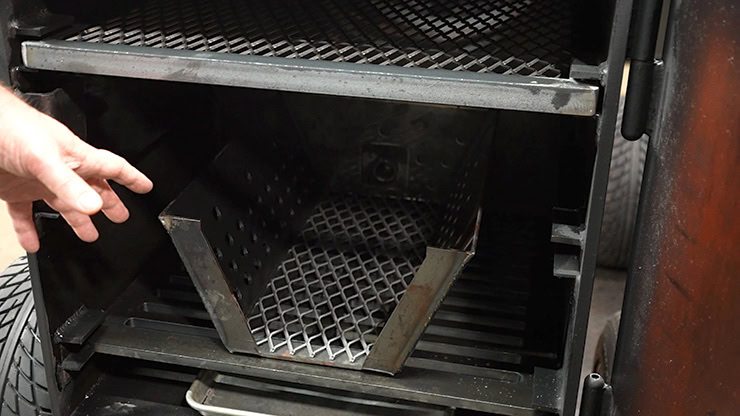 Fire management system inside the Lone Star Grillz offset smoker firebox
