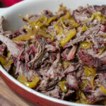 a casserole dish with smoked mississippi pot roast in it