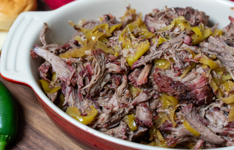 a casserole dish with smoked mississippi pot roast in it