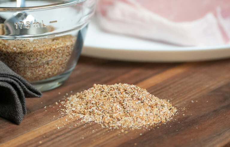 easy pork chop seasoning on a wooden chopping board